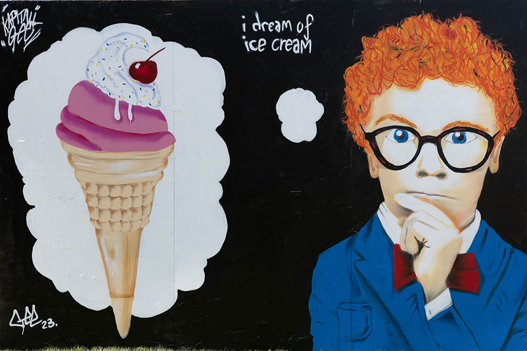 Mural showing an ice cream and a boy in spectacles